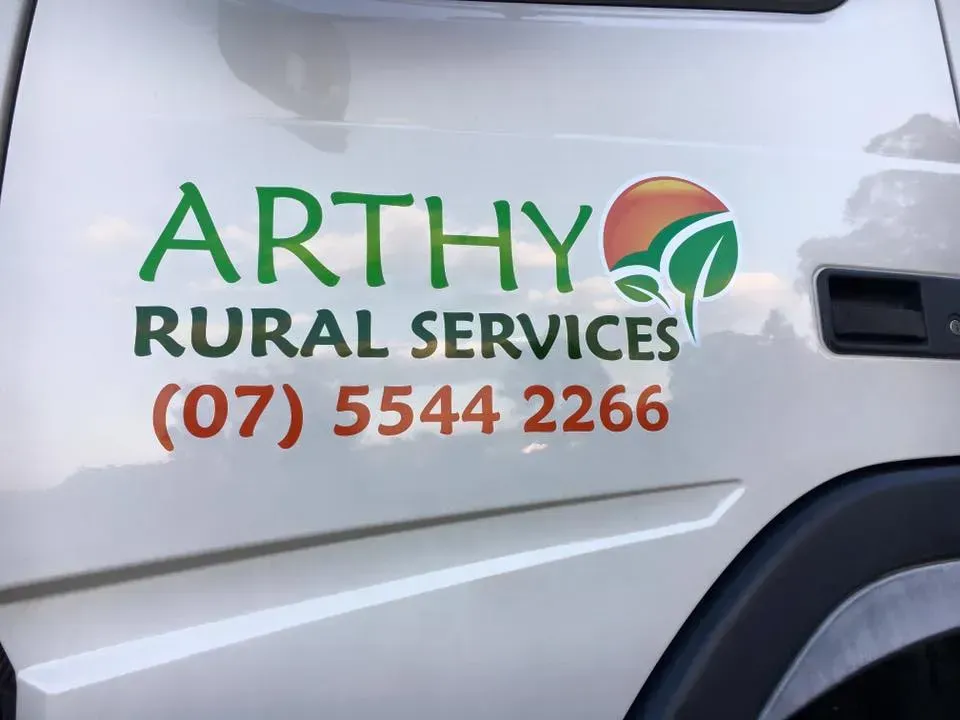 A white truck has a sticker on the side that says arthy rural services
