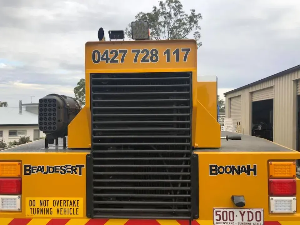A yellow truck with a license plate that says 500 ydo