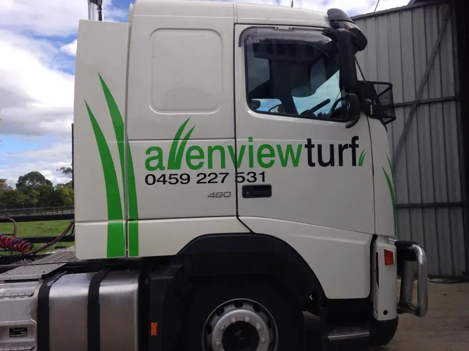 A white truck with the word allenview turf on the side