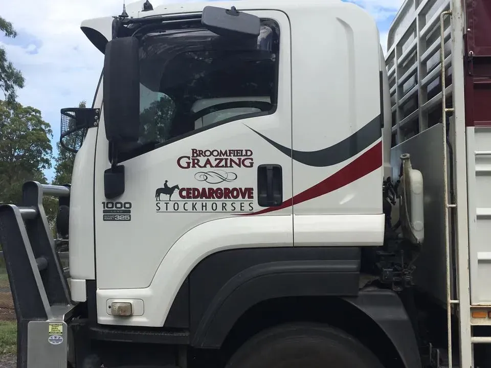 A white truck with the word grazing on the side