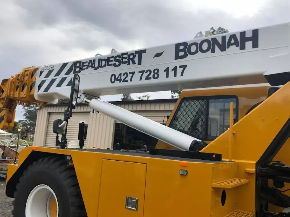A yellow crane with beaudesert boonah written on it