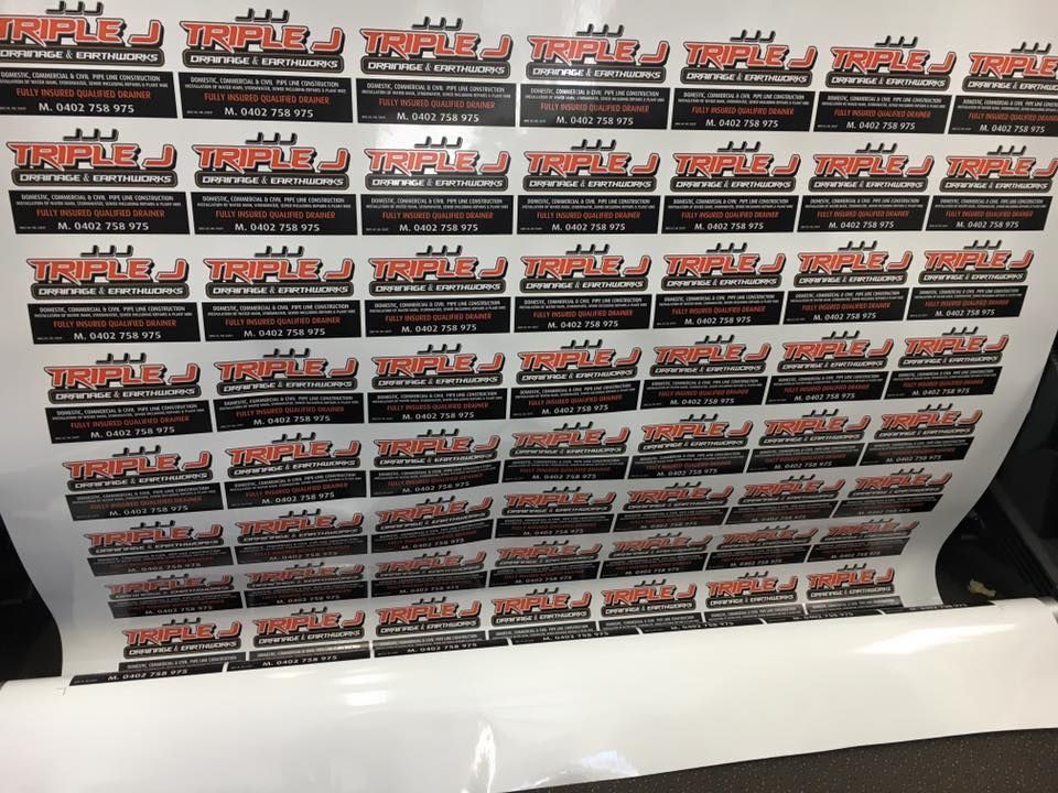 A bunch of stickers with the word triple on them