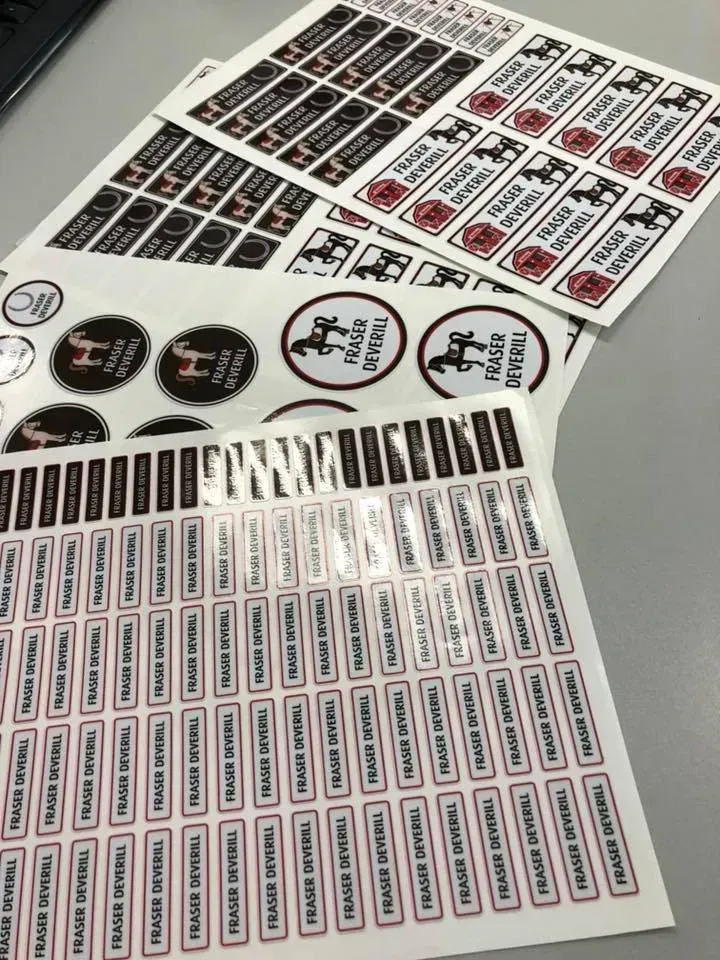 A bunch of stickers are laying on a table