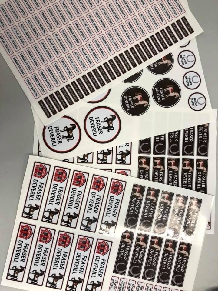 A bunch of stickers are stacked on top of each other