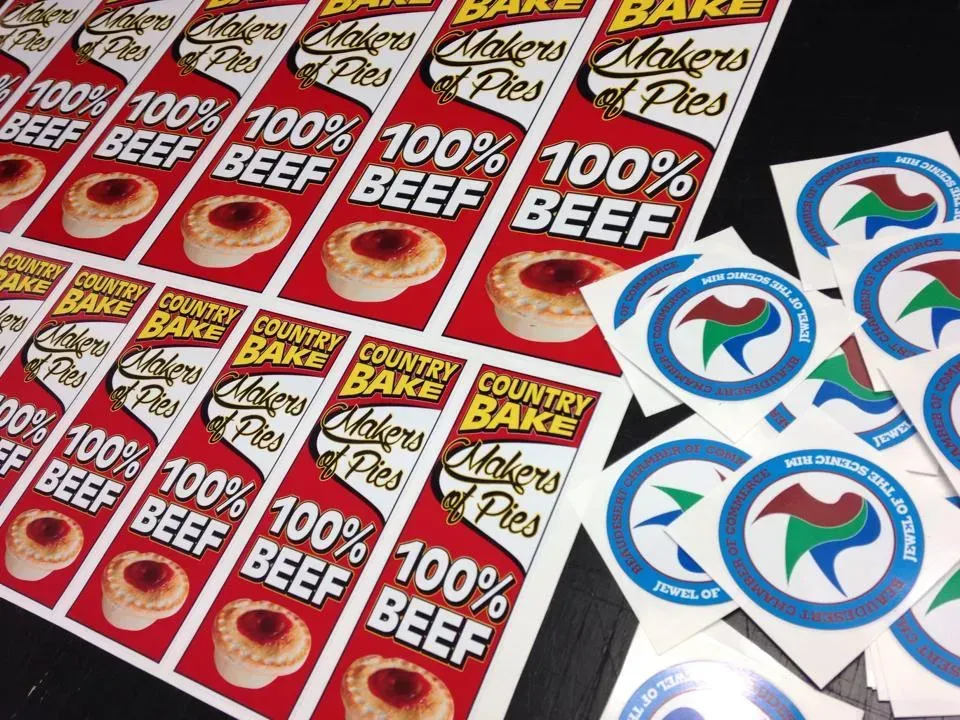 A bunch of stickers that say 100 % beef on them