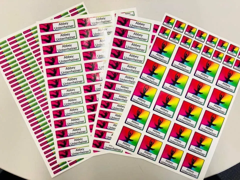 A bunch of stickers are stacked on top of each other on a table.