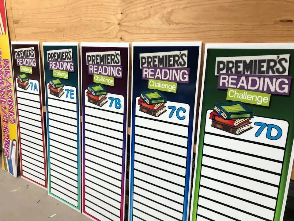 A row of signs for the premier 's reading challenge