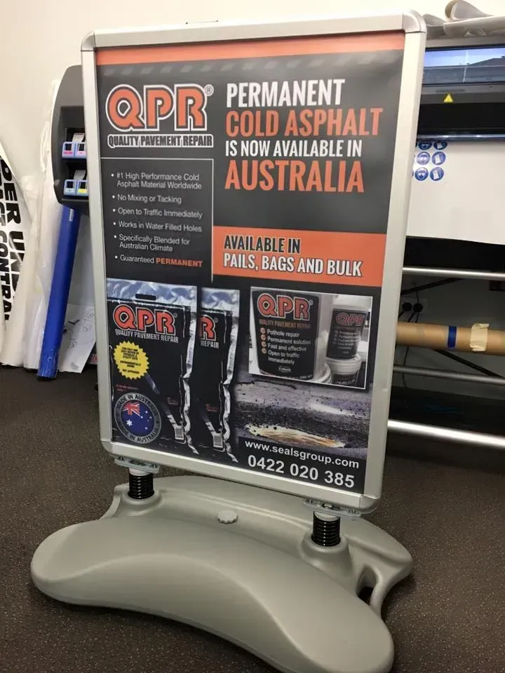 A sign that says permanent cold asphalt is now available in australia
