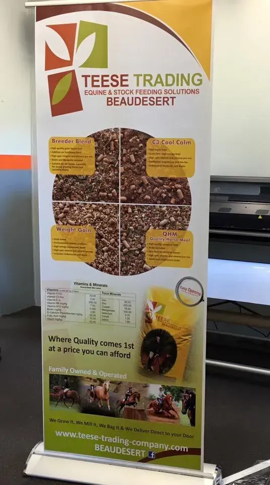 A banner for teese trading beaudesert is sitting on a table.