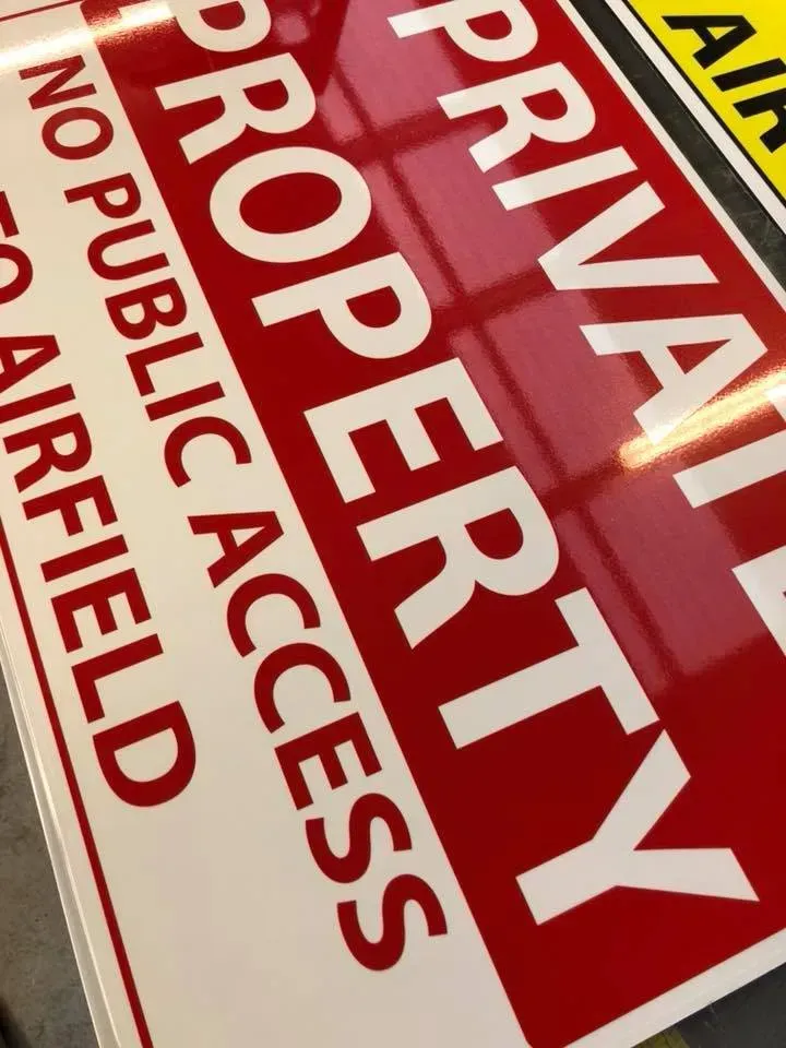 A red and white sign that says private property no public access