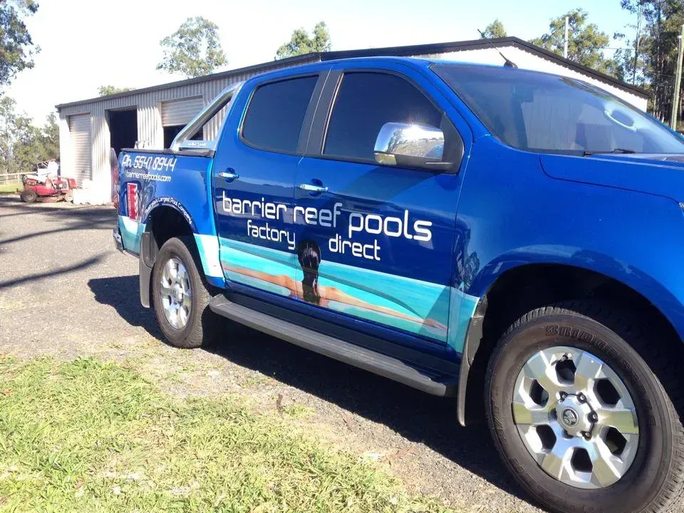 A blue truck with the word pools on the side