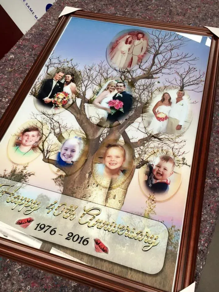 A framed picture of a family tree from 1976 to 2016