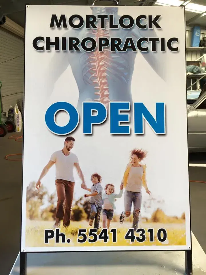 Mortlock chiropractic is open with a picture of a family