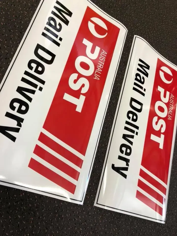 Two signs that say mail delivery on them