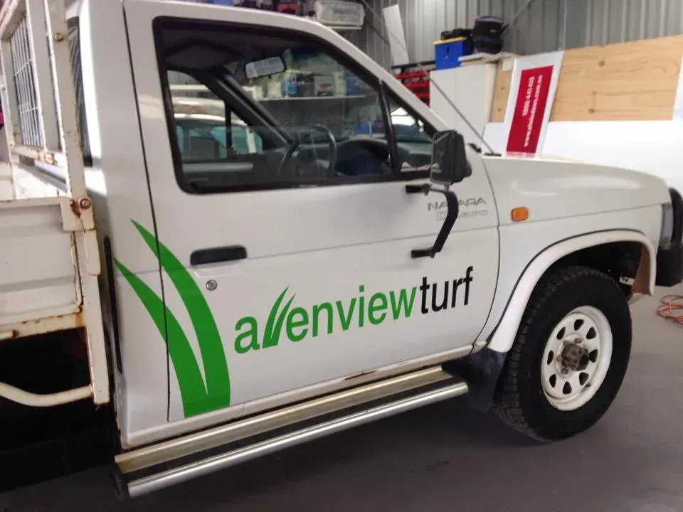 A white truck with the word avenview turf on the side