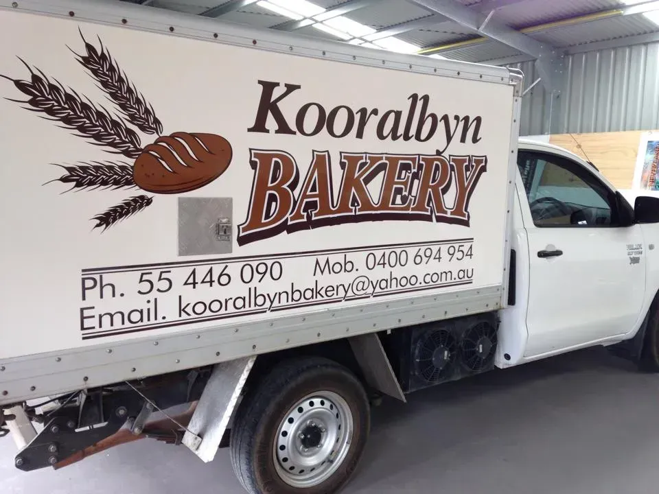 A white truck with the word bakery on it