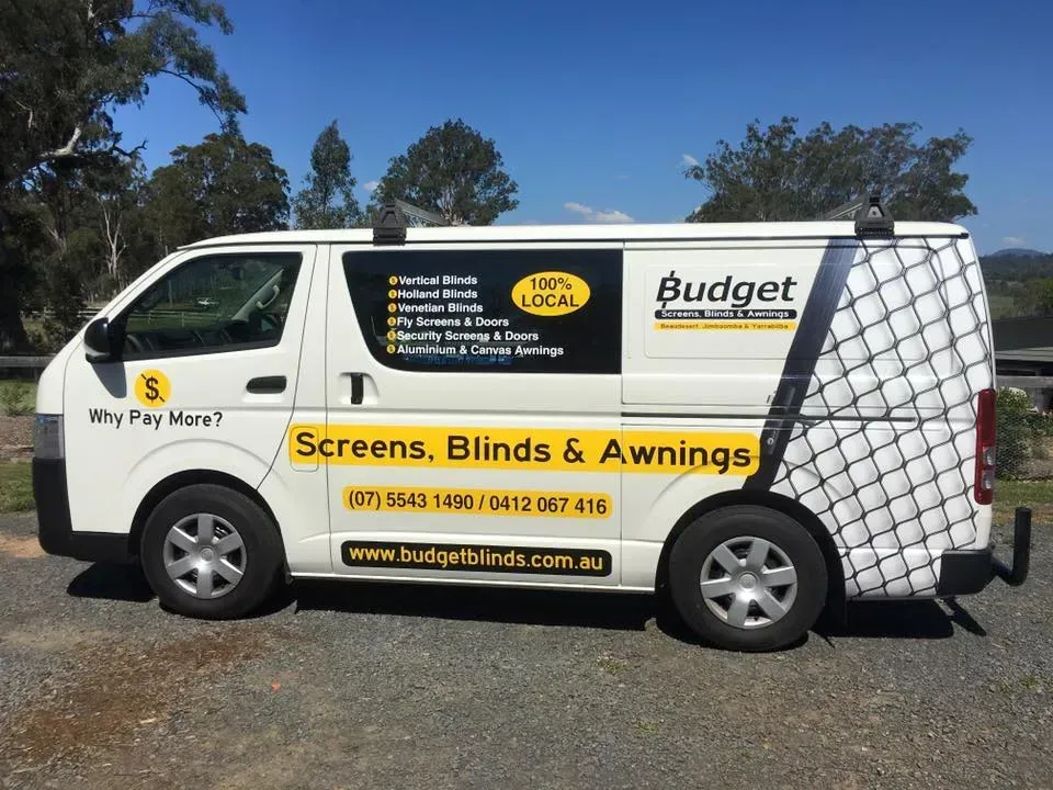 A white van with the word budget on it