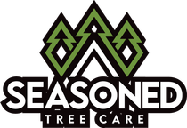 Seasoned Tree Care logo with green tree shapes above bold black text