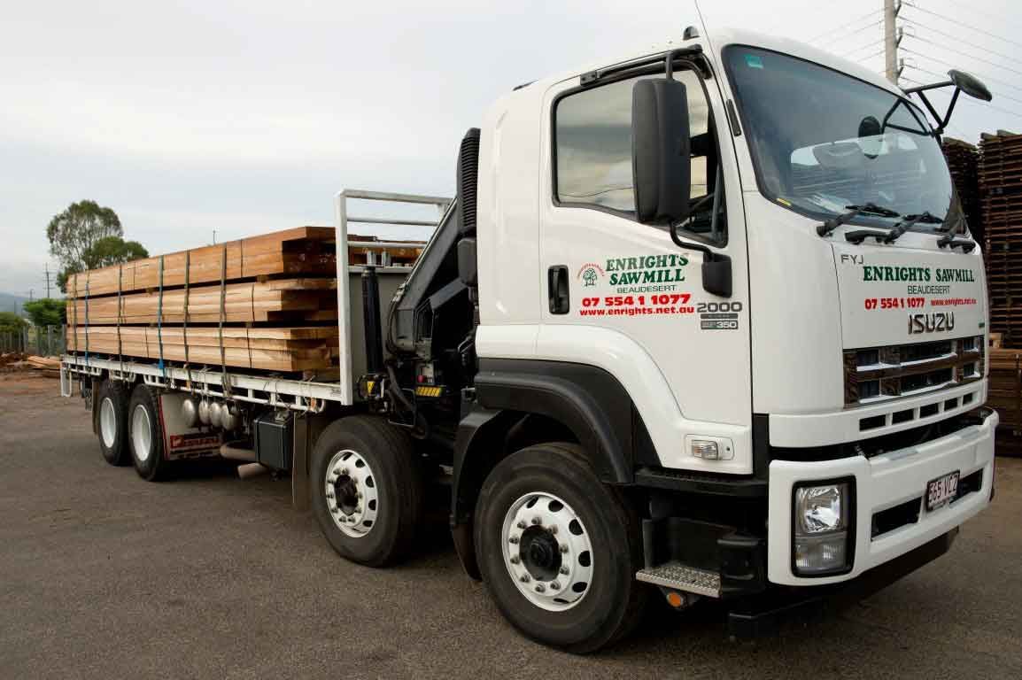 A White Truck Is Carrying A Load Of Wood – Beaudesert, QLD - Enrights Sawmill