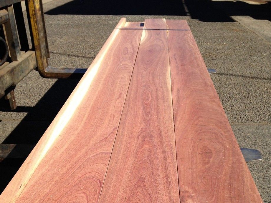 A Large Piece Of Wood Is Sitting On The Ground Next To A Forklift – Beaudesert, QLD - Enrights Sawmill