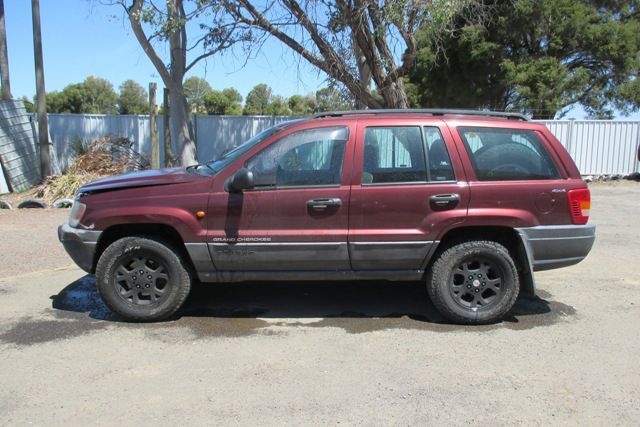 Red Jeep Grand Cherokee — Urangan, QLD — Jeeepart Recyclers