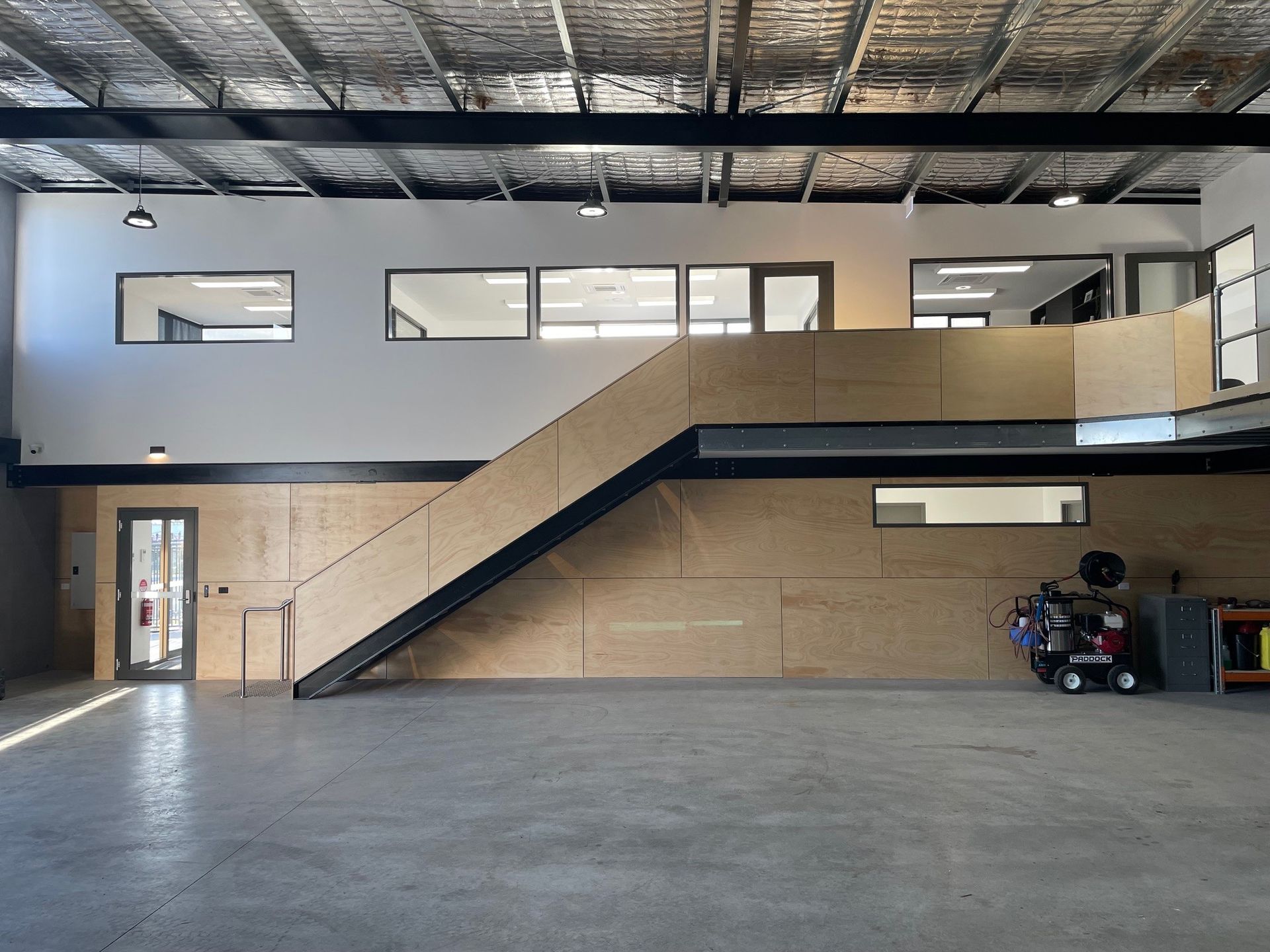 A Staircase Leading Up To The Second Floor Of A Building – Cambridge, TAS - Bennett Construction (TAS)