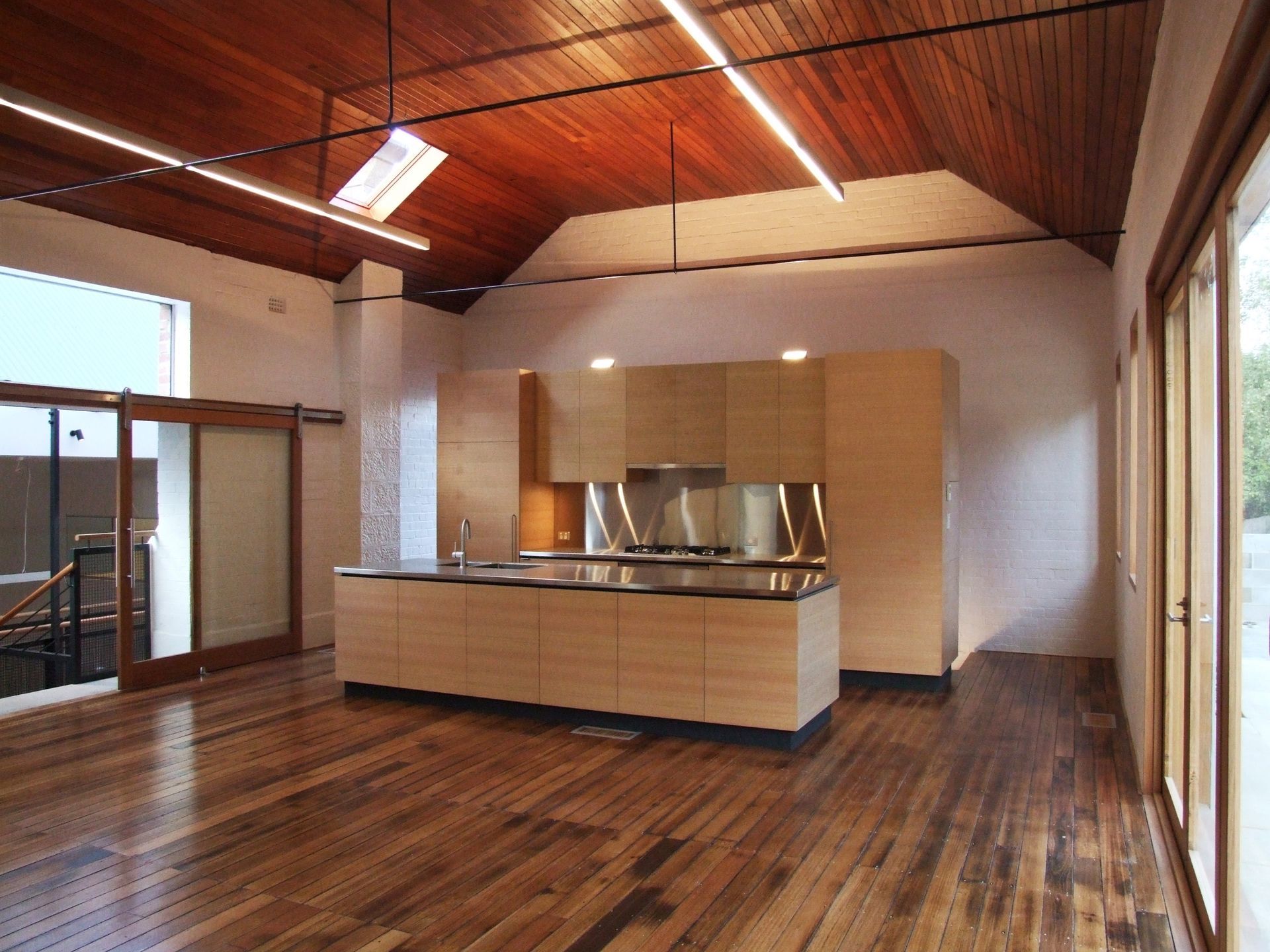 An Empty Kitchen With Wooden Floors And A Wooden Ceiling – Cambridge, TAS - Bennett Construction (TAS)