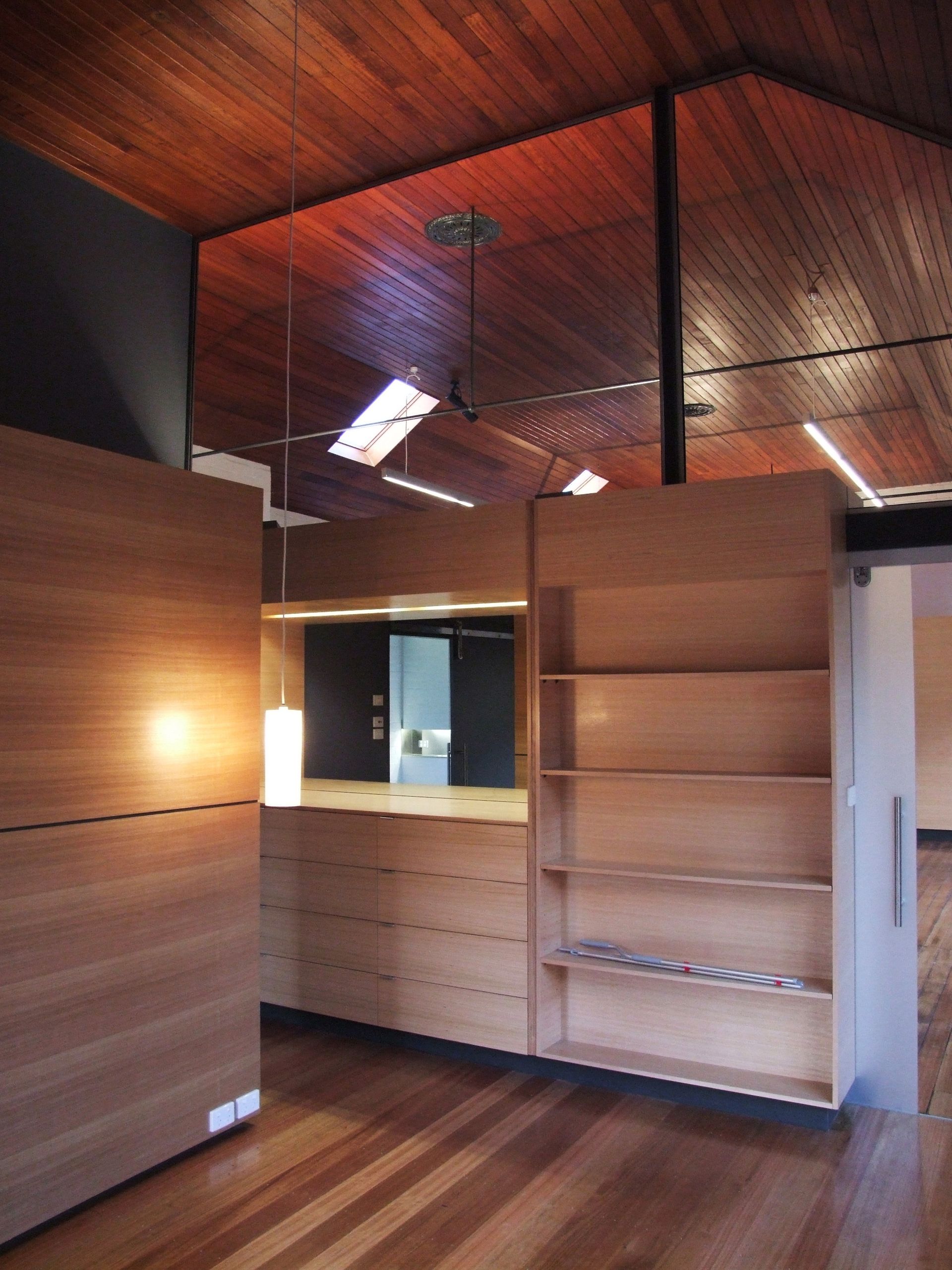 An Empty Room With Wooden Shelves And A Wooden Ceiling – Cambridge, TAS - Bennett Construction (TAS)