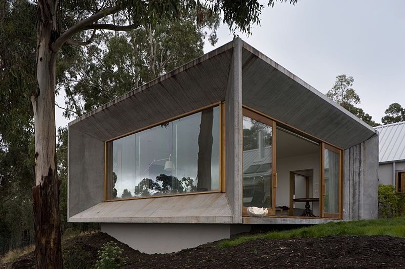 A House With A Lot Of Windows And Trees In The Background – Cambridge, TAS - Bennett Construction (TAS)