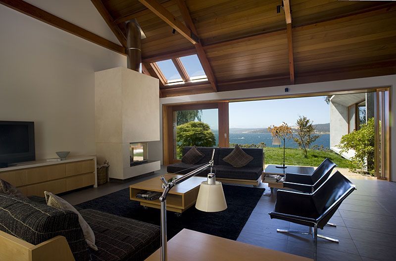 A Living Room With A Lot Of Furniture And A View Of The Ocean – Cambridge, TAS - Bennett Construction (TAS)