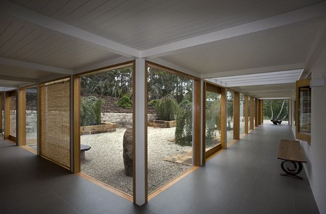 A Long Hallway With Lots Of Windows And A Bench – Cambridge, TAS - Bennett Construction (TAS)