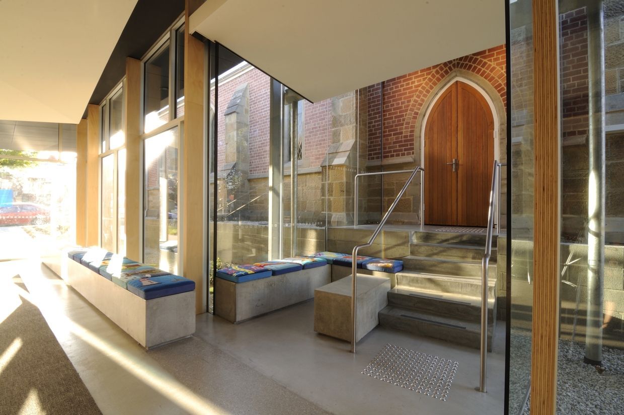 A Hallway With A Brick Building In The Background – Cambridge, TAS - Bennett Construction (TAS)
