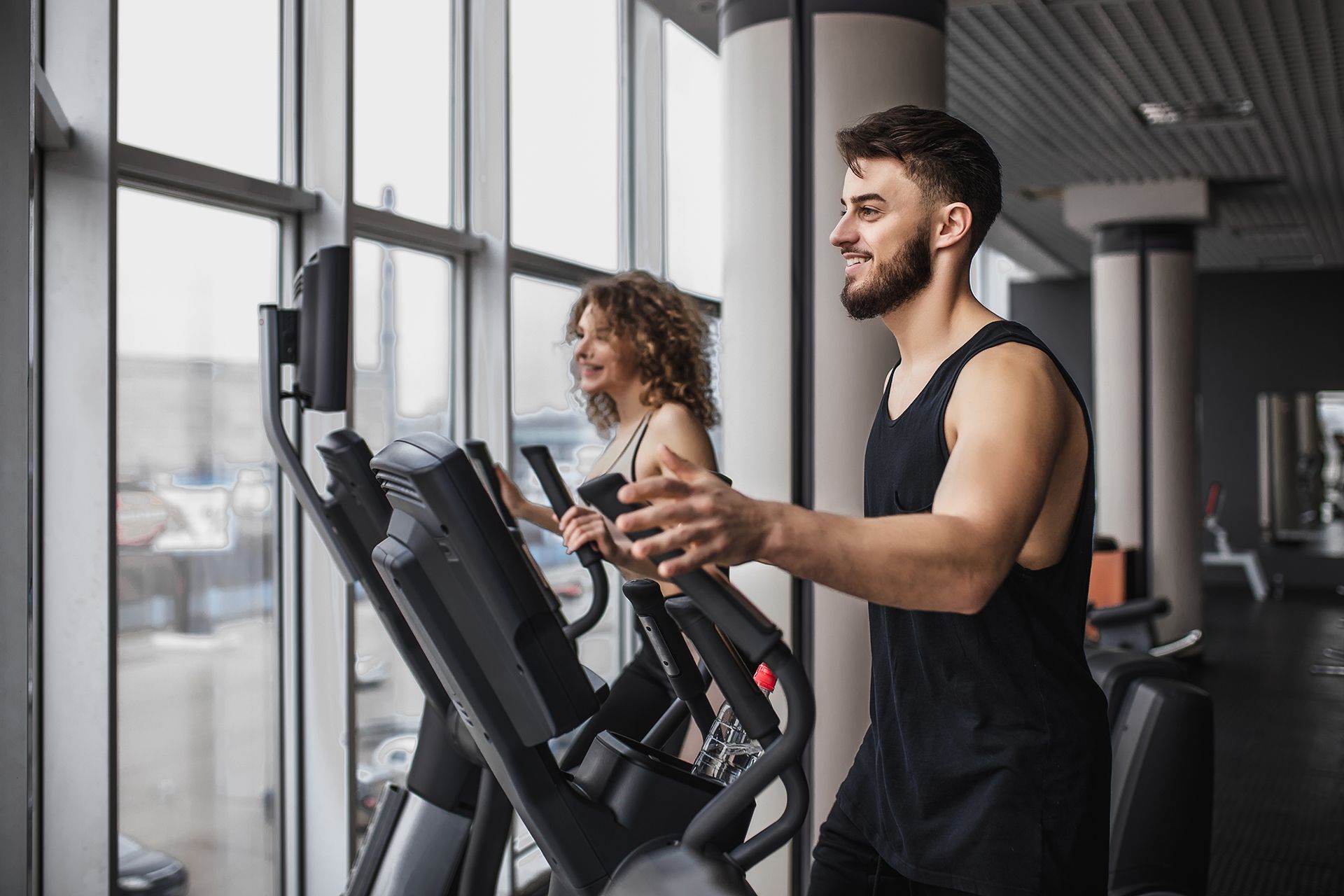 Couple Running on Treadmill
