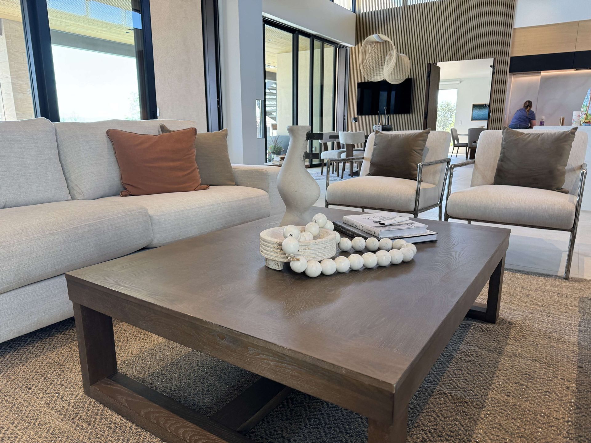 A living room with a couch and chairs and a coffee table