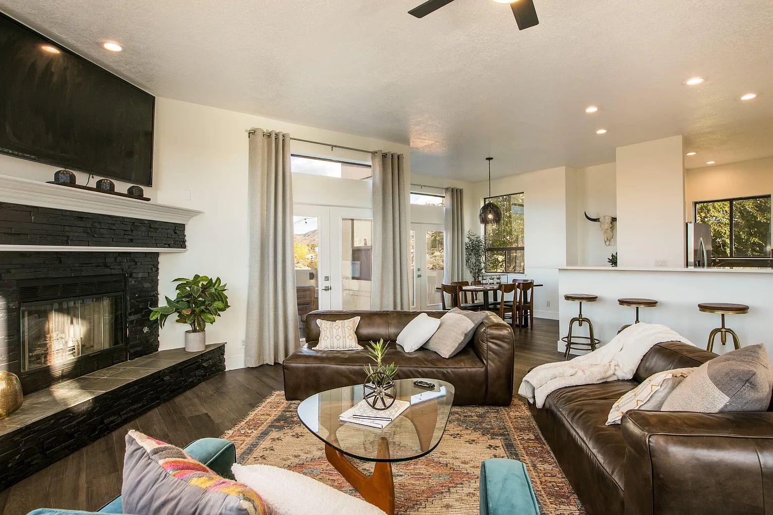 A living room filled with furniture and a fireplace.