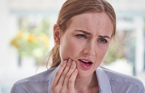 Woman Suffering From Toothache — Clarkston, MI — Mark Frenchi DDS