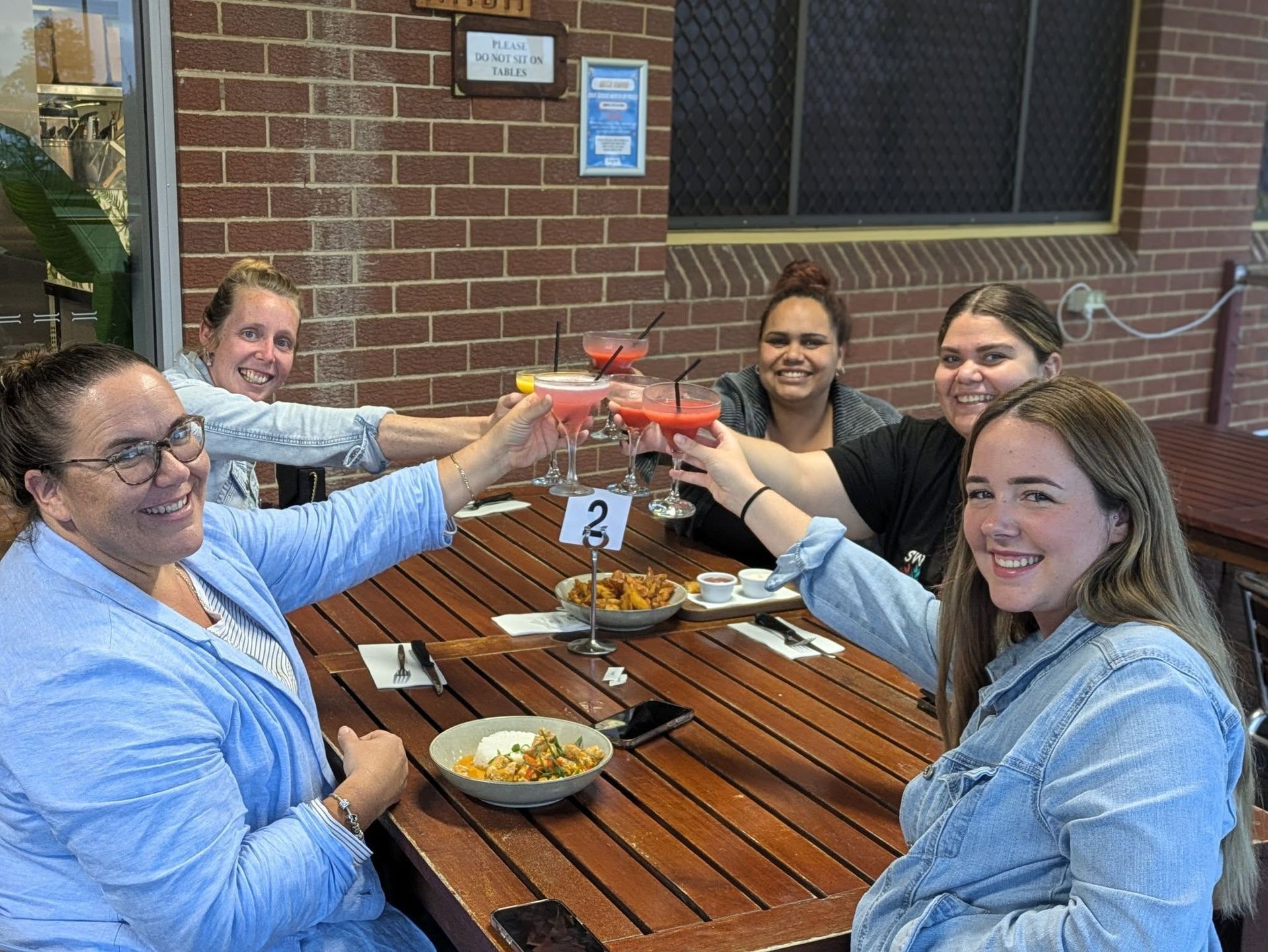 A Table Topped With Plates Of Food Including A Sandwich And French Fries — Taree Railway Bowling Club Ltd In Taree, NSW