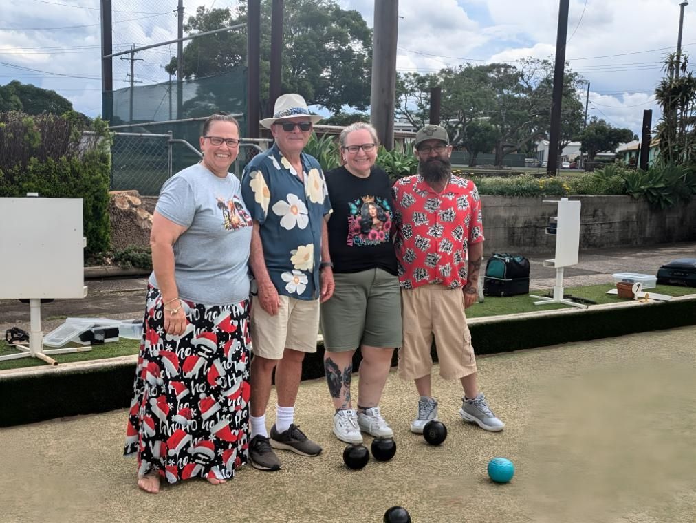 A Group Of People Are Standing Next To Each Other On A Bowling Alley — Taree Railway Bowling Club Ltd In Taree, NSW