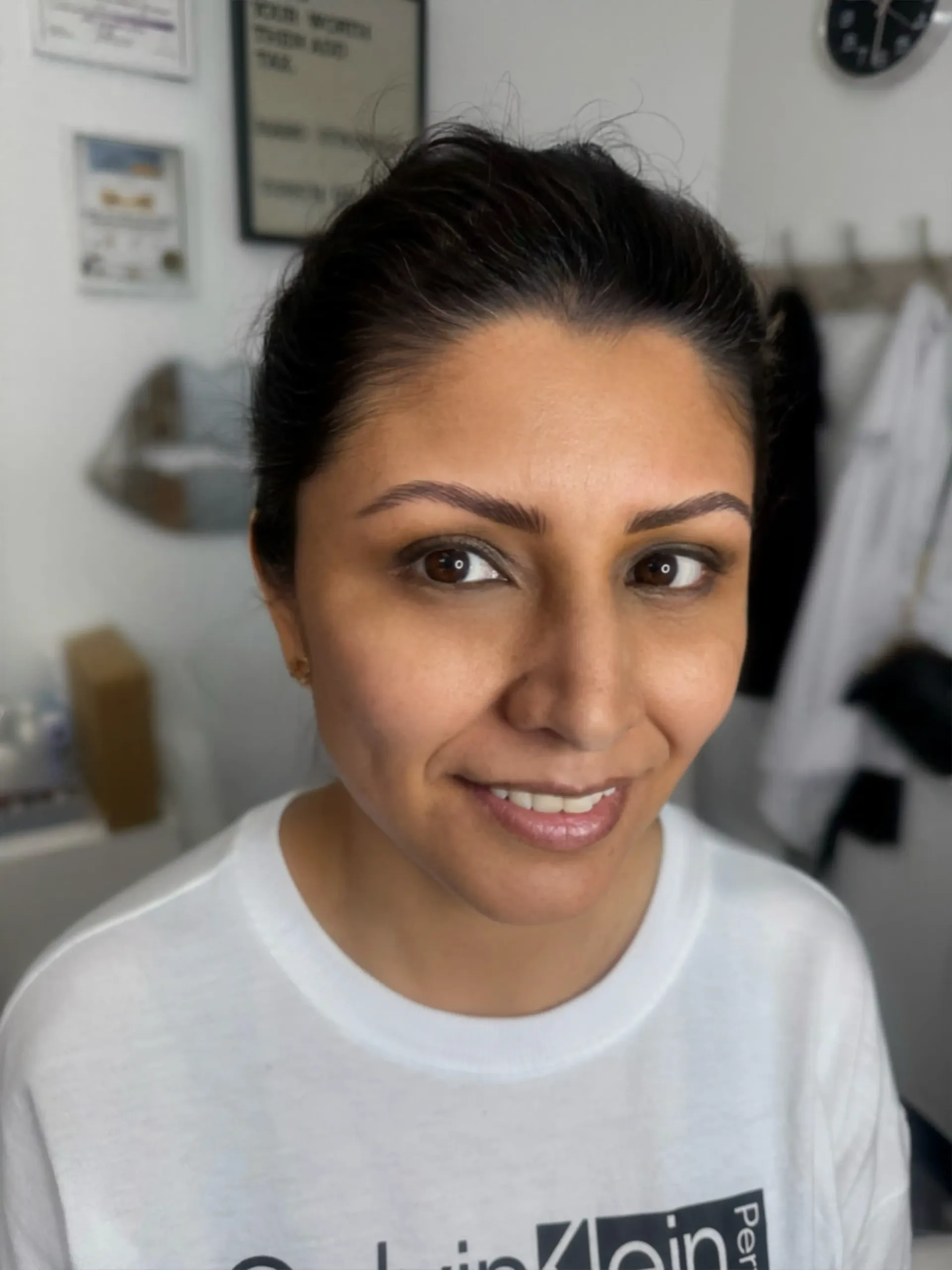 A woman wearing a white t-shirt that says linkedin