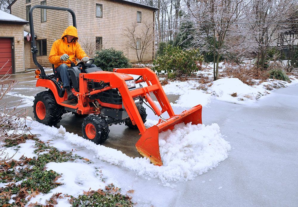 removing snow from a driveway
