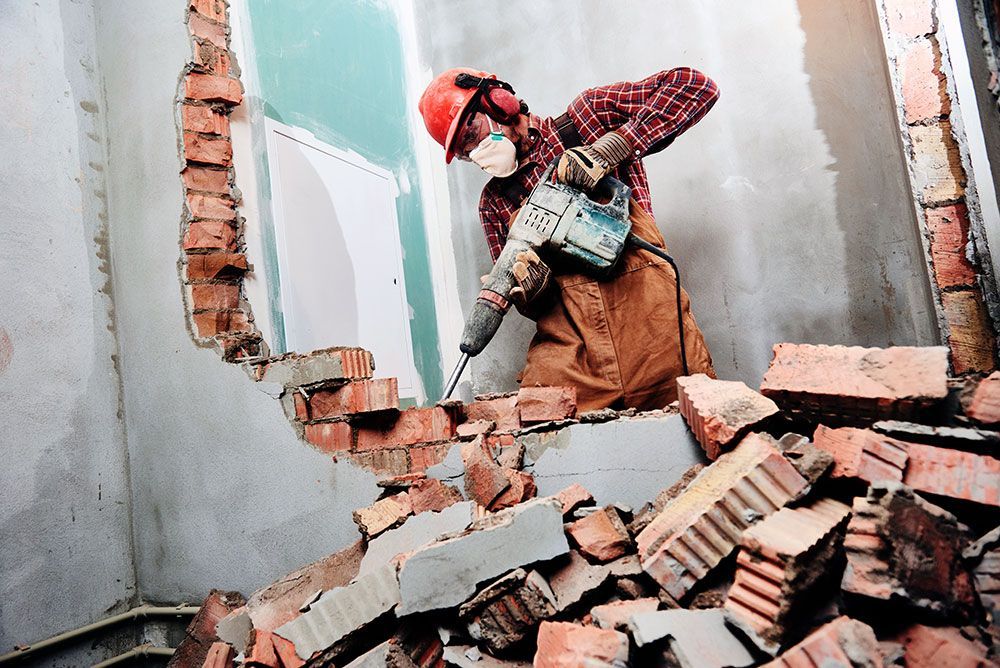 demolishing a brick wall