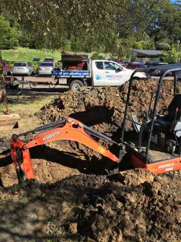 Excavator Digging — Plumbers in Central Coast, NSW