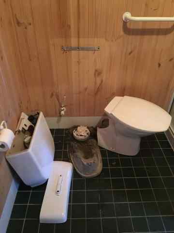 Toilet Being Repaired — Plumbers in Central Coast, NSW