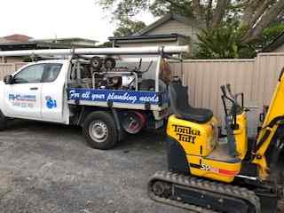 Service Truck And Excavator  — Plumbers in Central Coast, NSW