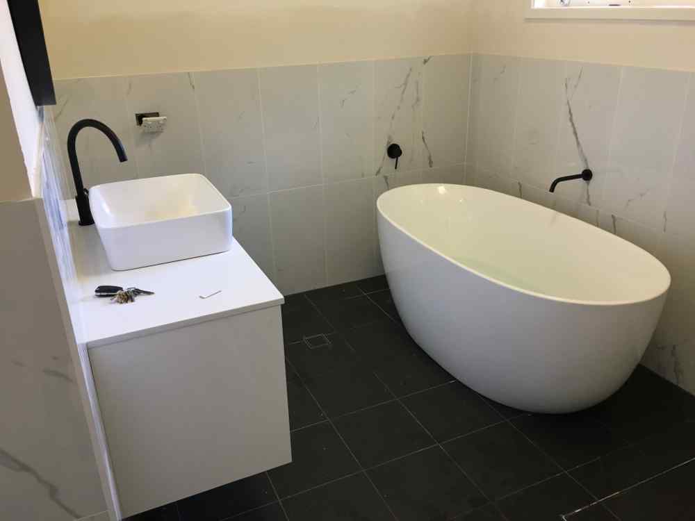Bathroom With Black Fixtures — Plumbers in Central Coast, NSW