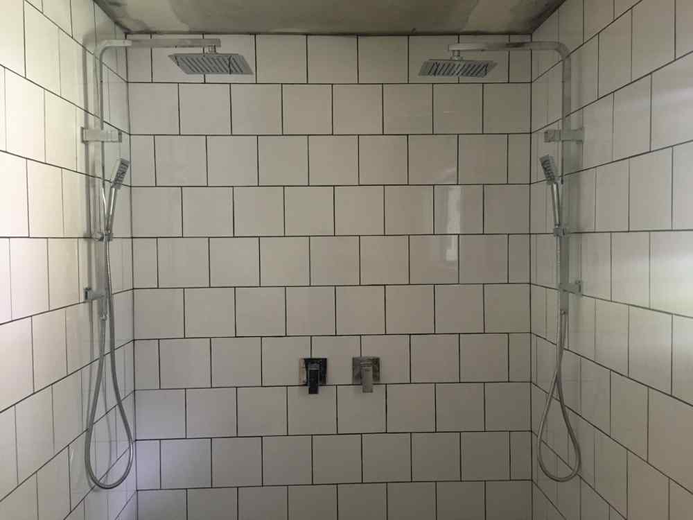 Shower With White Tiles — Plumbers in Woy Woy, NSW