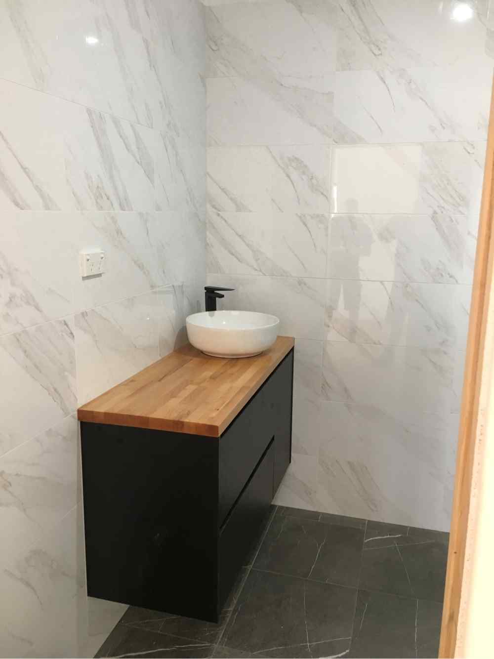 Bathroom With Tiles Walls — Plumbers in Central Coast, NSW