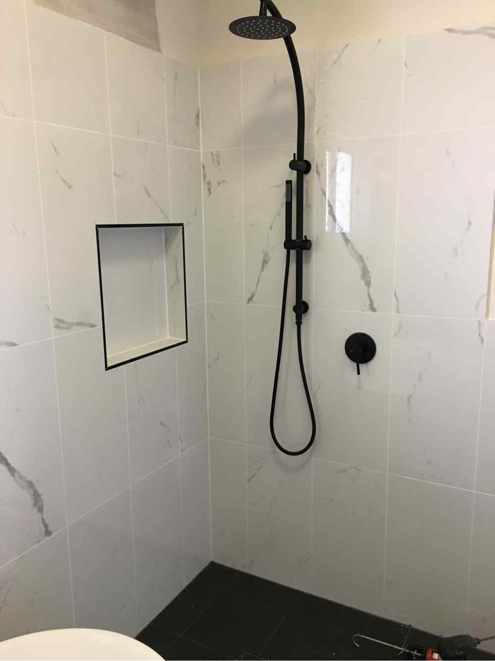 Shower With Marble Tiles — Plumbers in Central Coast, NSW
