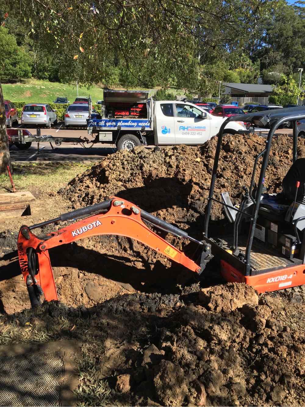 Excavator Digging Hole — Plumbers in Central Coast, NSW