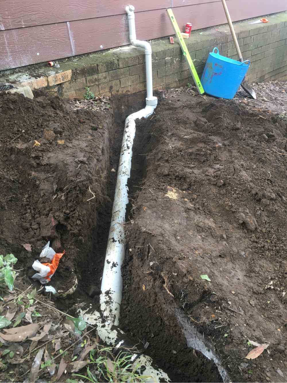 Digging Up Underground Pipes — Plumbers in Central Coast, NSW